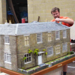 Geoff Collard putting the finishing touches to Woodborough Farmhouse